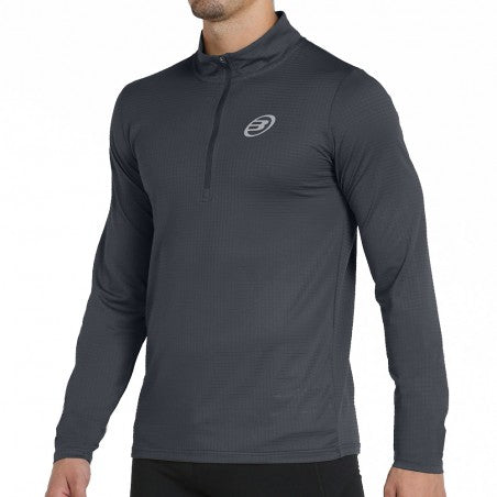 Veste Bullpadel Beid Noir portée par un joueur